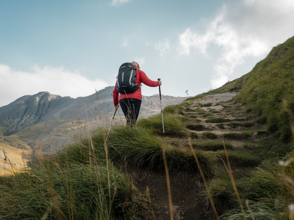 When to swap from walking poles to a short safety belay on steep grassy exits